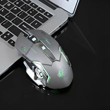 Gaming mouse with green accents on a laptop