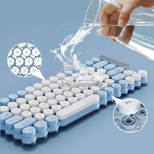 Keyboard with water being poured over it on a blue background