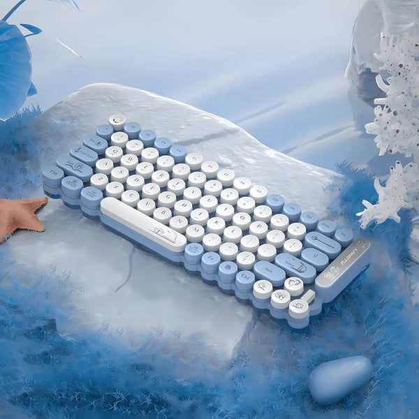 Blue and white typewriter-style keyboard on a snowy background