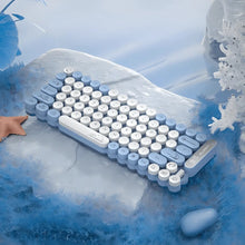 Blue and white typewriter-style keyboard on a snowy background
